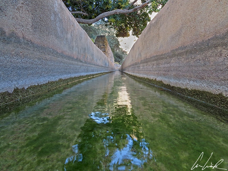 The falaj is a clever and very old irrigation system. Water flows through canals from springs to the cultivated lands.