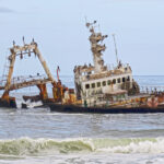 The Zeila Shipwrek is a rusty wreck abandoned in the waves of the Atlantic Ocean on the Namibian coast.