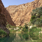 The Wadi Shab is a natural canyon in the Hajar Mountains. The ochre walls are also reflected in the numerous emerald-colored pools.