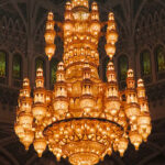 The main chandelier, made of 24-carat gold, is 26 feet in diameter. It is 46 feet tall, weighs eight tons, and includes 600,000 crystals and 1122 halogen bulbs.