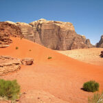 The desert of Wadi Rum offers breathtaking landscapes, with its red sand, its giant cliffs and its orange dunes.