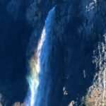 The Arpenaz waterfall displays the colors of a rainbow in good weather conditions, when the sun's rays hit it at the right angle.